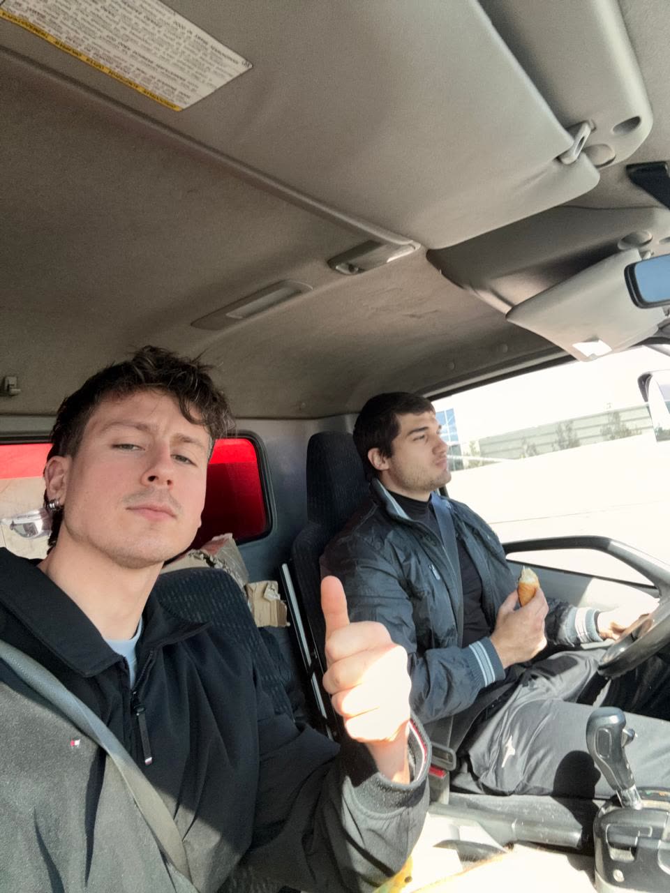 Jonathan and Lucas, founders of LuckyMove, in the truck between moves in Sydney