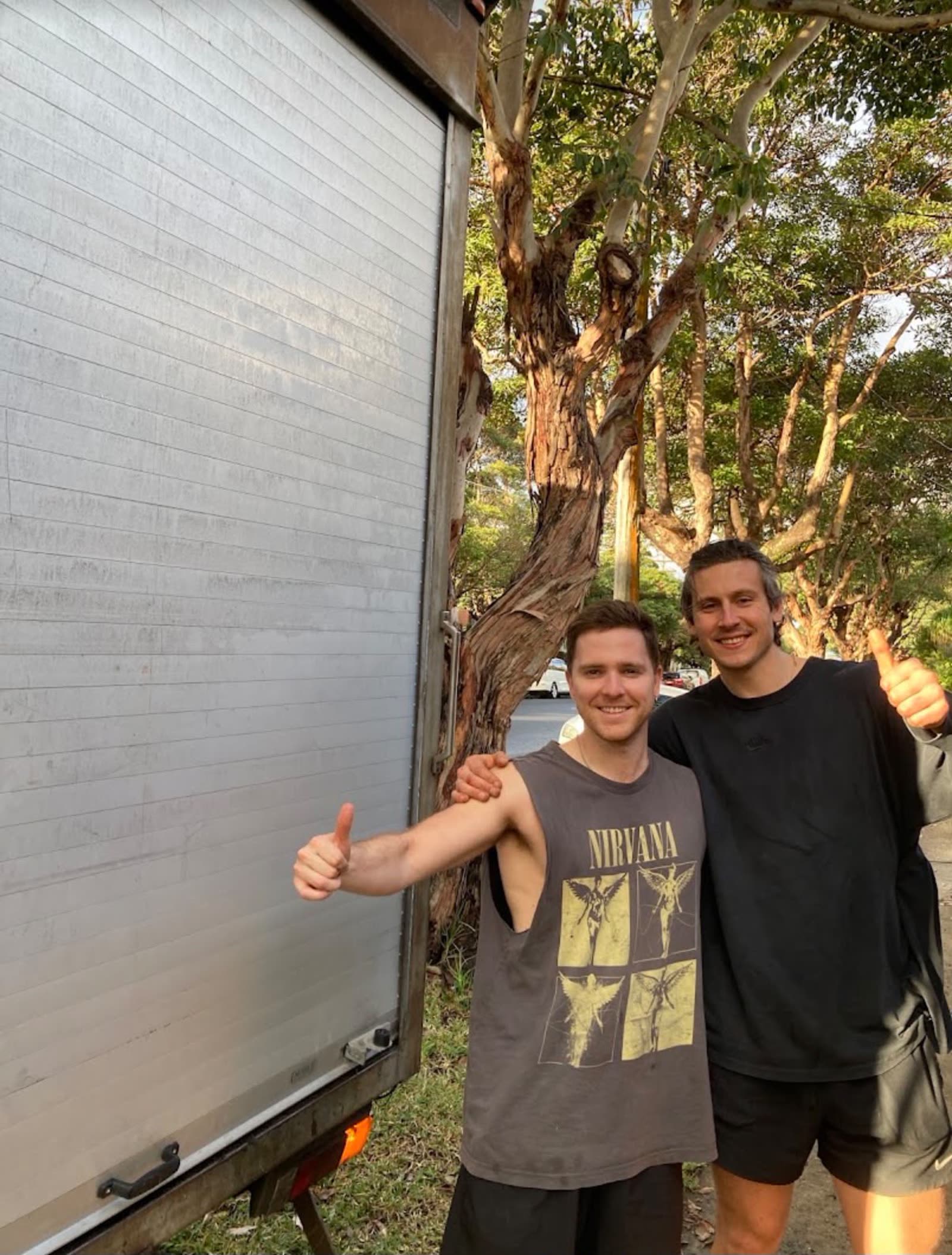 Two LuckyMove movers beside the truck after a completed move