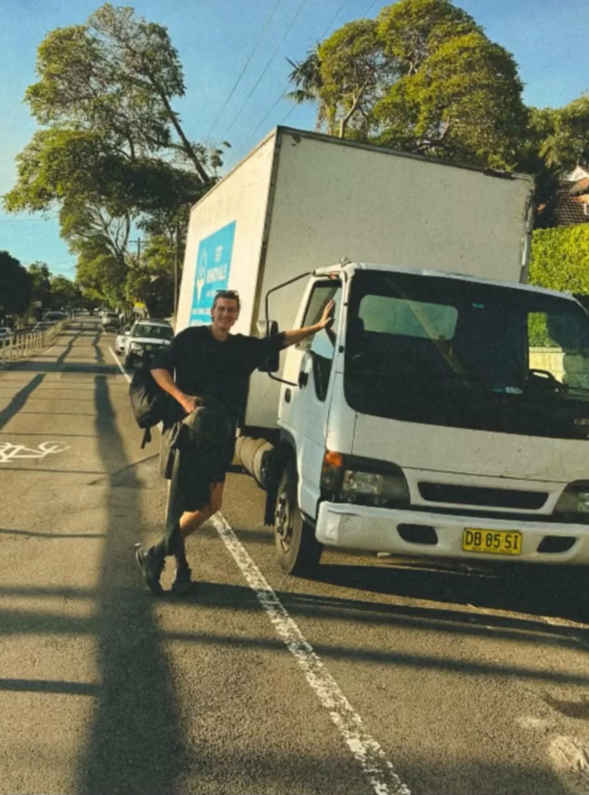 LuckyMove truck parked on a leafy Sydney street